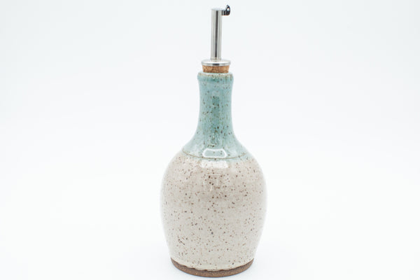 Oil bottle in speckled clay with Spiced Cream and Teal glaze