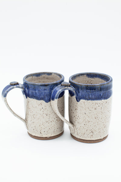 Mug in speckled clay with Spiced Cream and Blue glaze