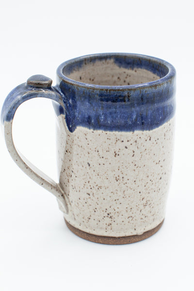 Mug in speckled clay with Spiced Cream and Blue glaze