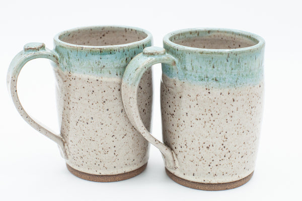 Mug in speckled clay with Spiced Cream and Teal glaze