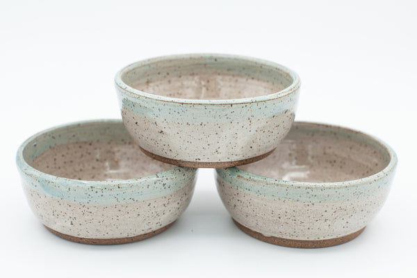 Condiment bowl in speckled clay with Spiced Cream and Teal glaze