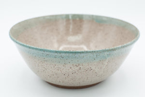 Bowl in speckled clay with Spiced Cream and Teal glaze