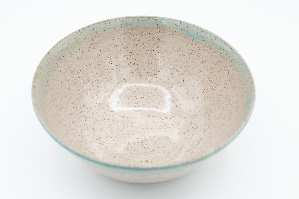 Bowl in speckled clay with Spiced Cream and Teal glaze