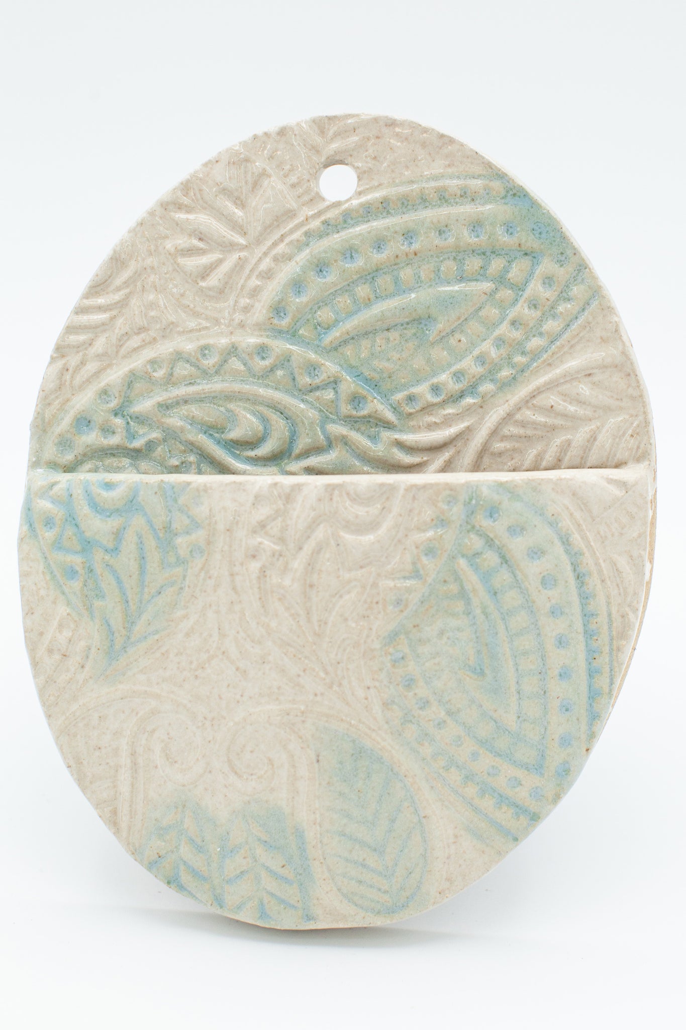 Wall pocket in Spiced Cream and Teal glaze