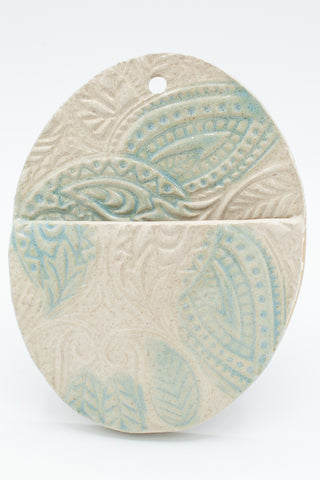 Wall pocket in Spiced Cream and Teal glaze