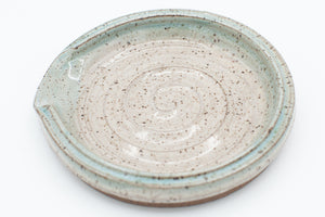 Spoon rest in speckled clay with Spiced Cream and Teal glaze