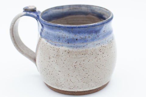 Mug in speckled clay in spiced cream and blue glaze