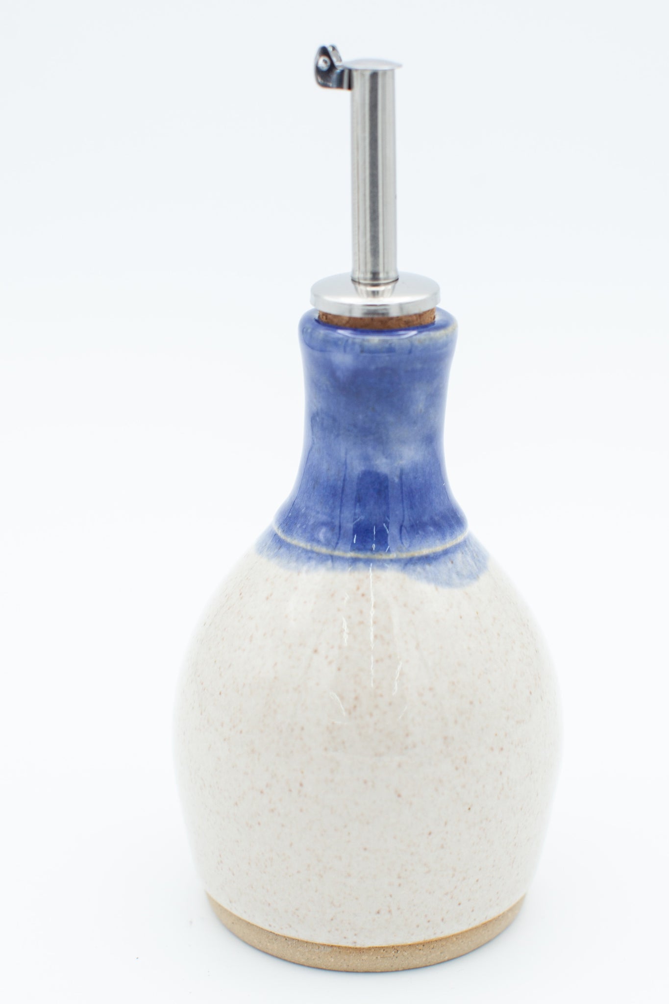 Oil bottle in spiced cream and blue glaze