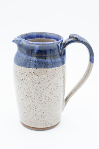 Pitcher in speckled clay with spiced cream and blue glaze