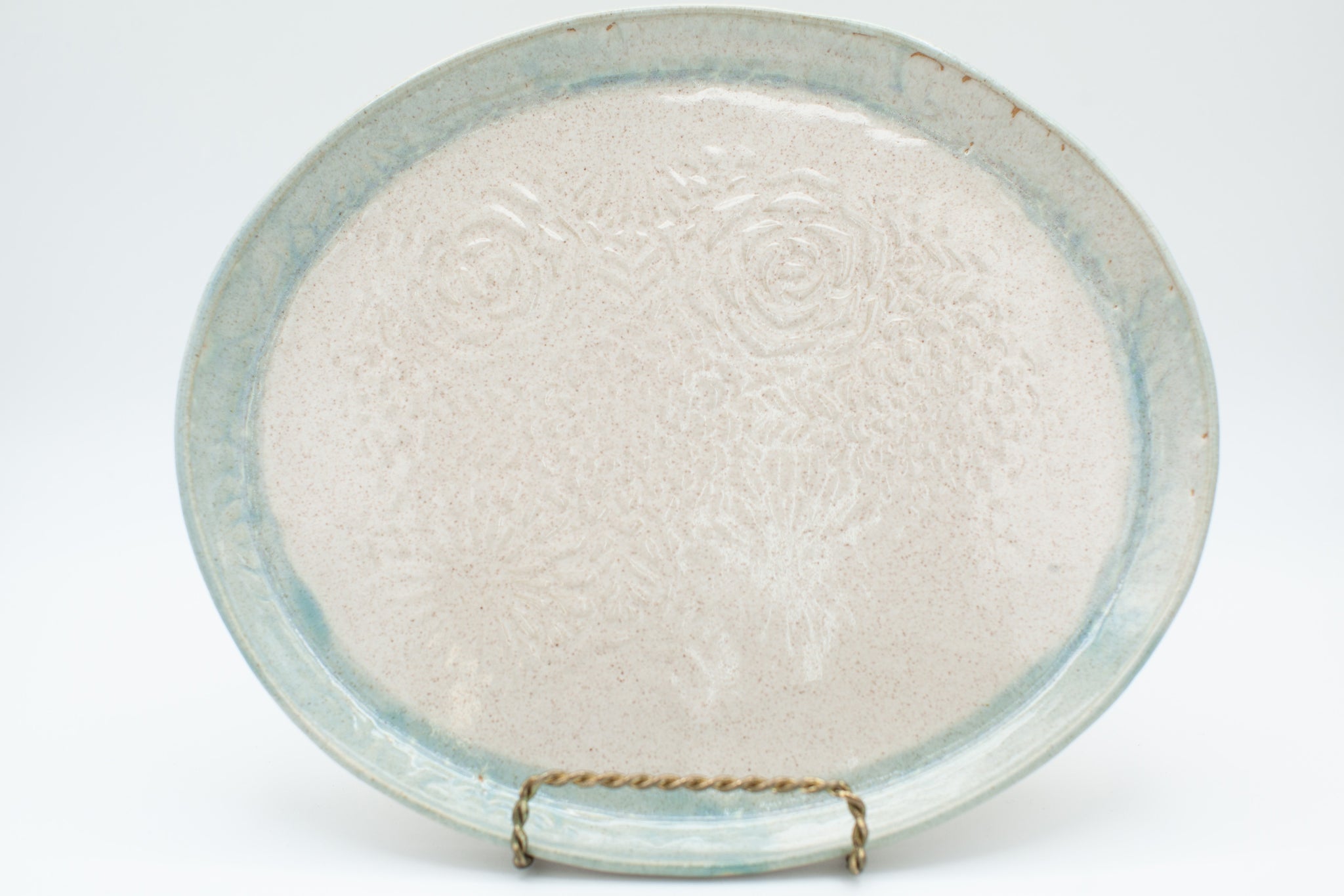 Oval platter in spiced cream and teal glaze