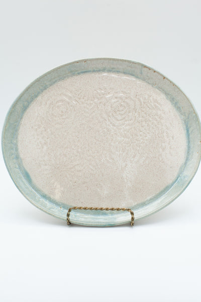 Oval platter in spiced cream and teal glaze