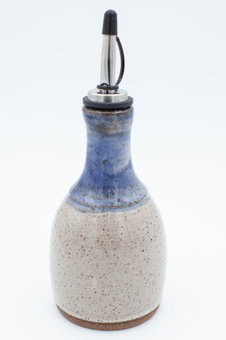 Oil bottle in speckled clay with spiced cream and blue glaze