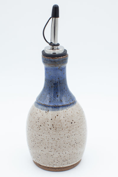 Oil bottle in speckled clay with spiced cream and blue glaze