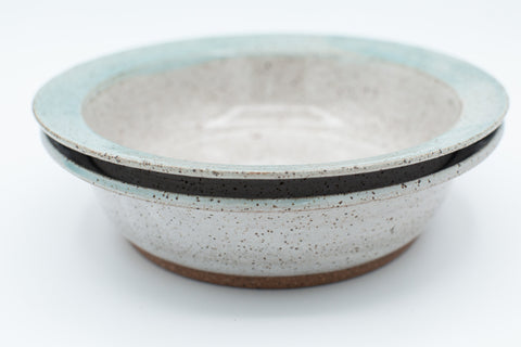 Bowl in speckled clay with spiced cream and teal glaze