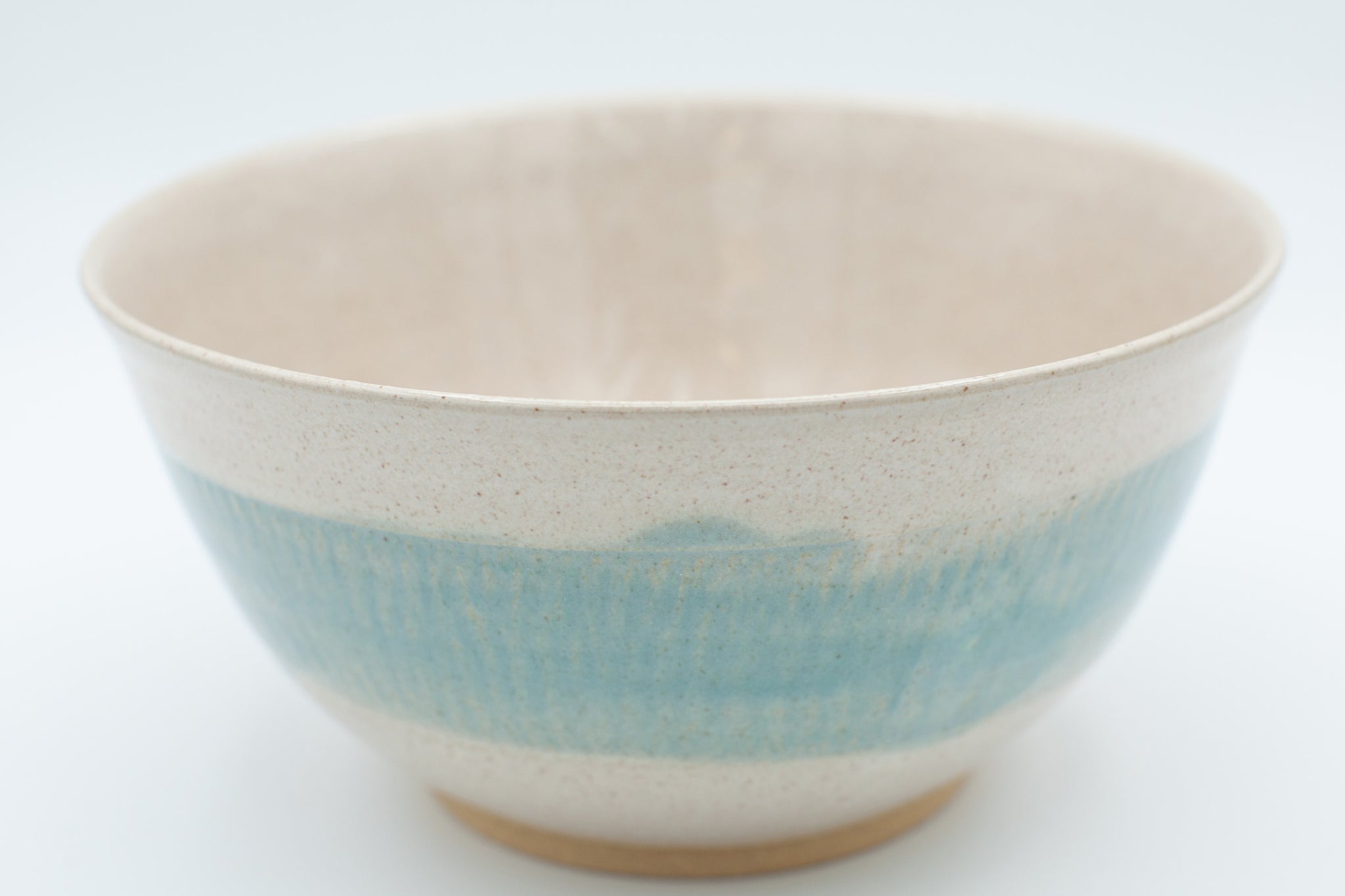 Serving bowl with spiced cream and teal glaze