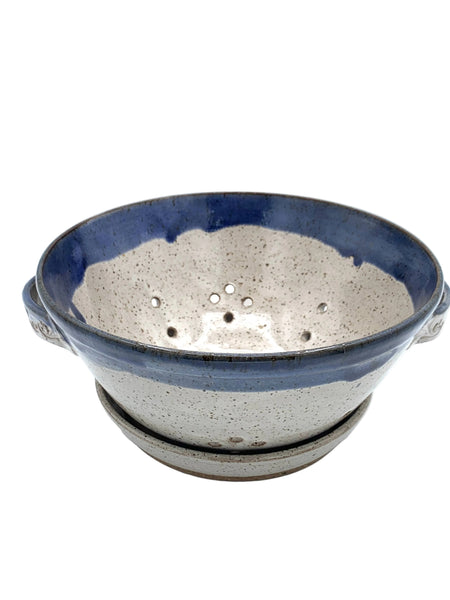 Handmade stoneware berry bowl with matching drain plate in speckled clay and blue glaze