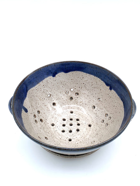 Handmade stoneware berry bowl with matching drain plate in speckled clay and blue glaze