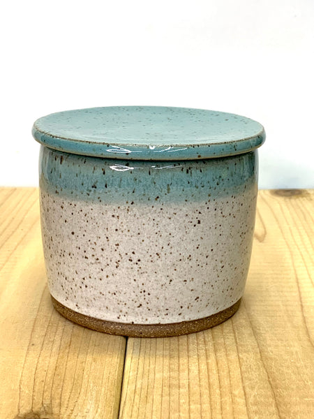 Handmade stoneware butter keeper in speckled clay with spiced cream and teal glaze