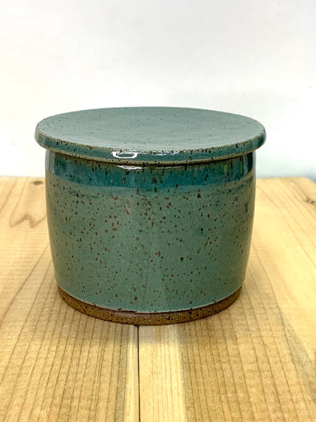 Handmade stoneware butter keeper in speckled clay with teal glaze