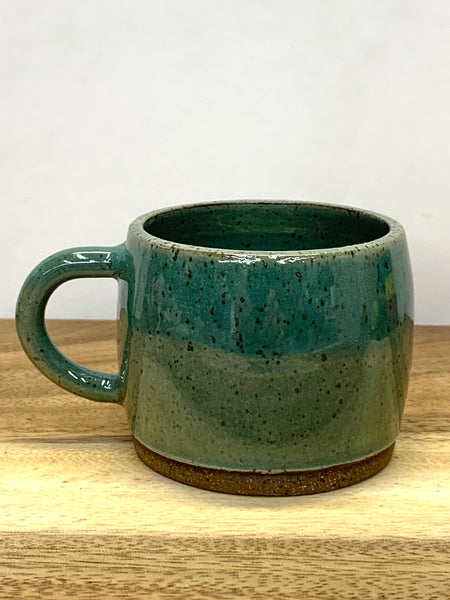 Handmade stoneware espresso cup in speckled clay with teal glaze