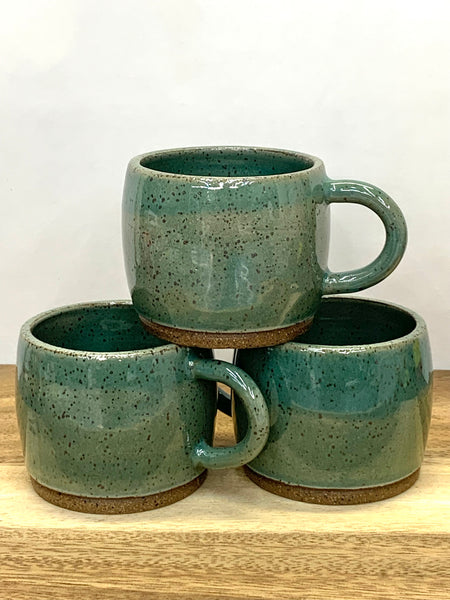 Handmade stoneware espresso cup in speckled clay with teal glaze