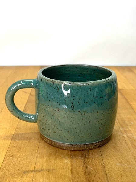 Handmade stoneware espresso cup in speckled clay with teal glaze
