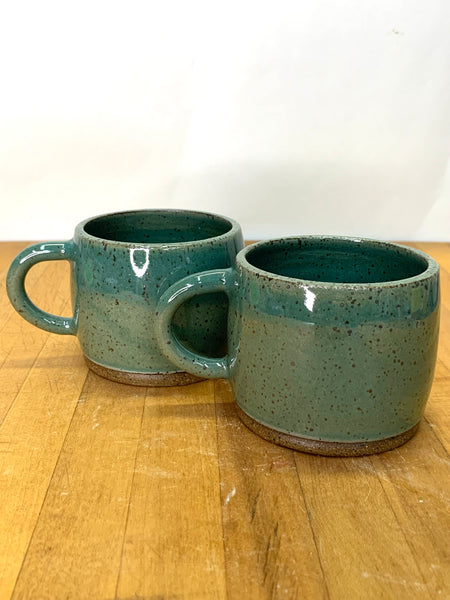 Handmade stoneware espresso cup in speckled clay with teal glaze