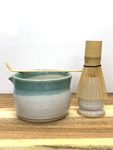 Handmade stoneware matcha bowl in spiced cream and teal glaze