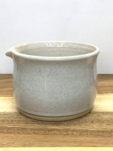 Handmade stoneware matcha bowl in spiced cream glaze

