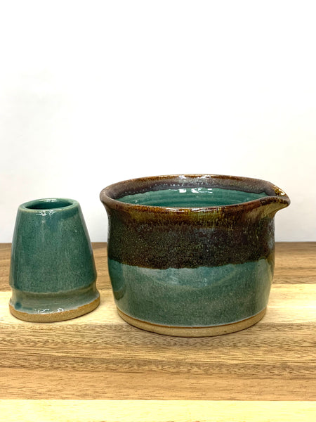 Handmade stoneware matcha bowl in teal and brown glaze
