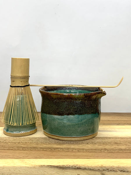 Handmade stoneware matcha bowl in teal and brown glaze
