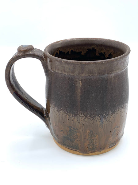 Handmade stoneware mug in brown and tan glaze