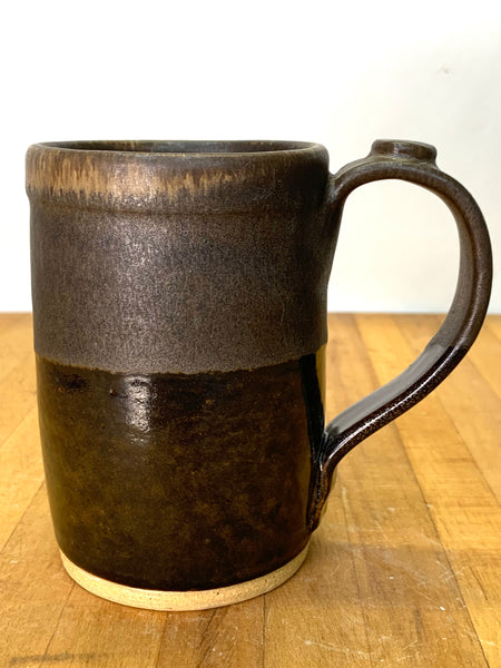 Handmade stoneware mug in brown and tan glaze