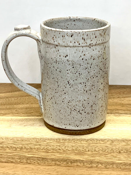 Handmade stoneware mug in speckled clay with spiced cream glaze