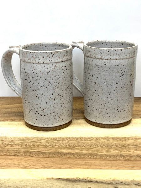 Handmade stoneware mug in speckled clay with spiced cream glaze