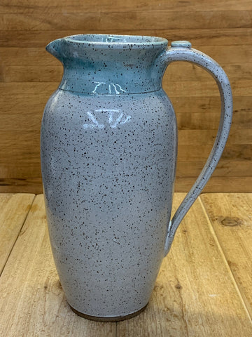 Pitcher in Speckled clay with Spiced Cream and Teal glaze