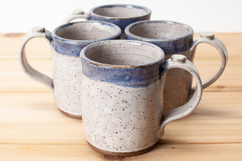 Mug in Aspen White and Blue glaze in speckled clay