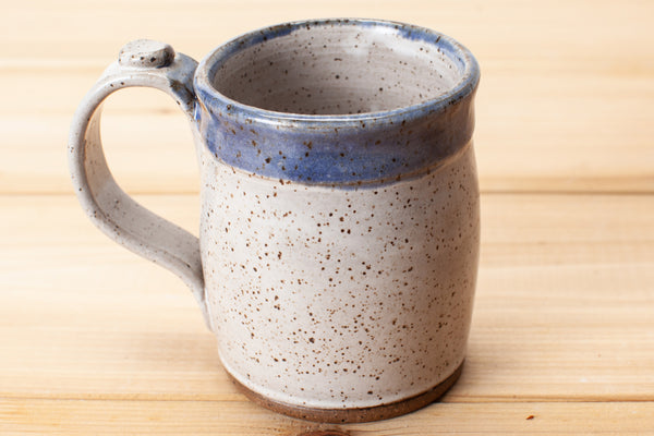 Mug in Aspen White and Blue glaze in speckled clay